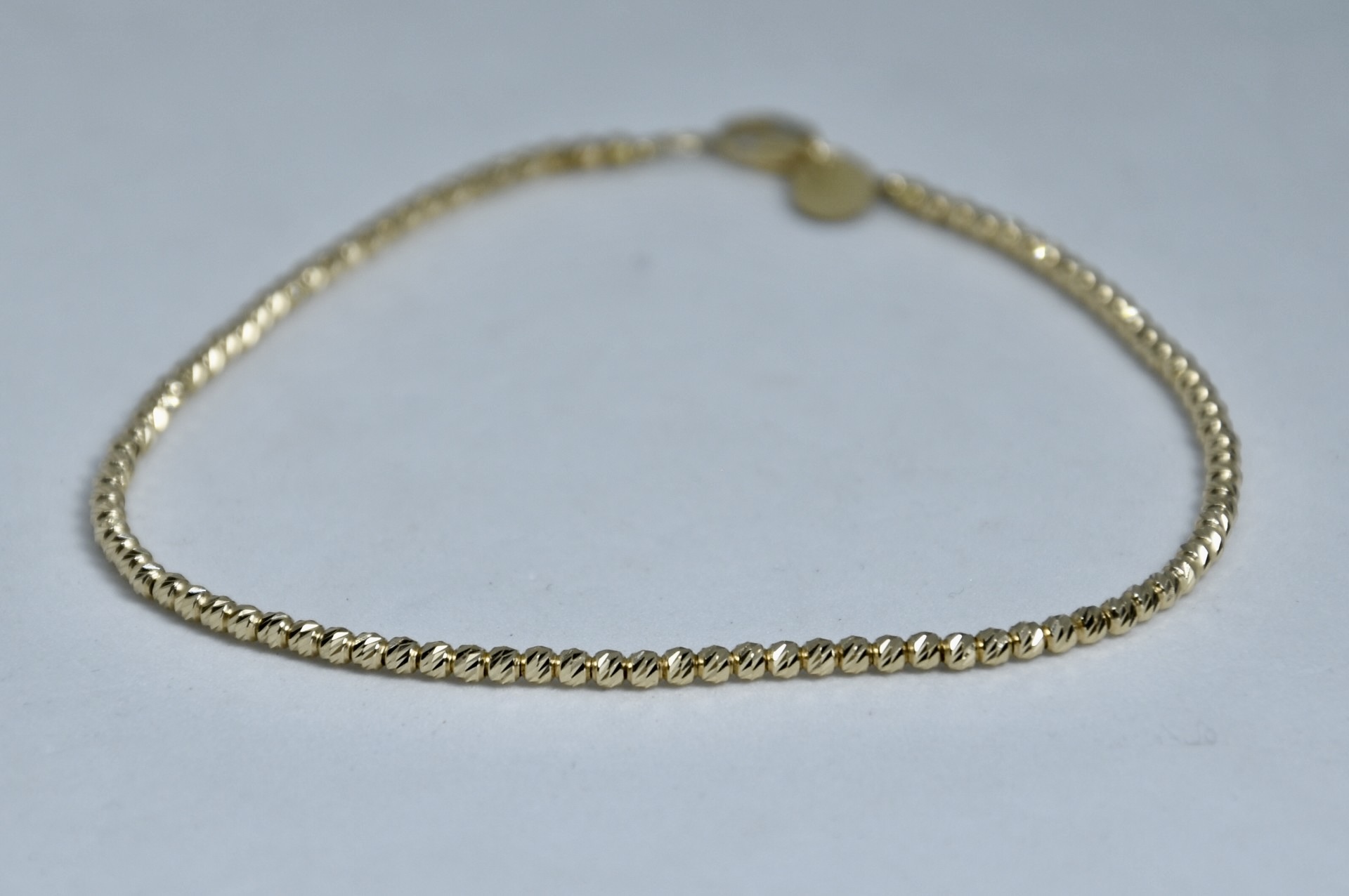 Immagine di BRACCIALE PALLINE SFACETTATE ORO GIALLO